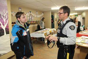 An OPP officer is seen speaking with a student at a "Reality Tour" event that was held in 2015, at Pleasant Corners Public School, in Vankleek Hill. The event teaches kids and their family members about the impact of drug and alcohol abuse. (Photo: Tara Kirkpatrick)