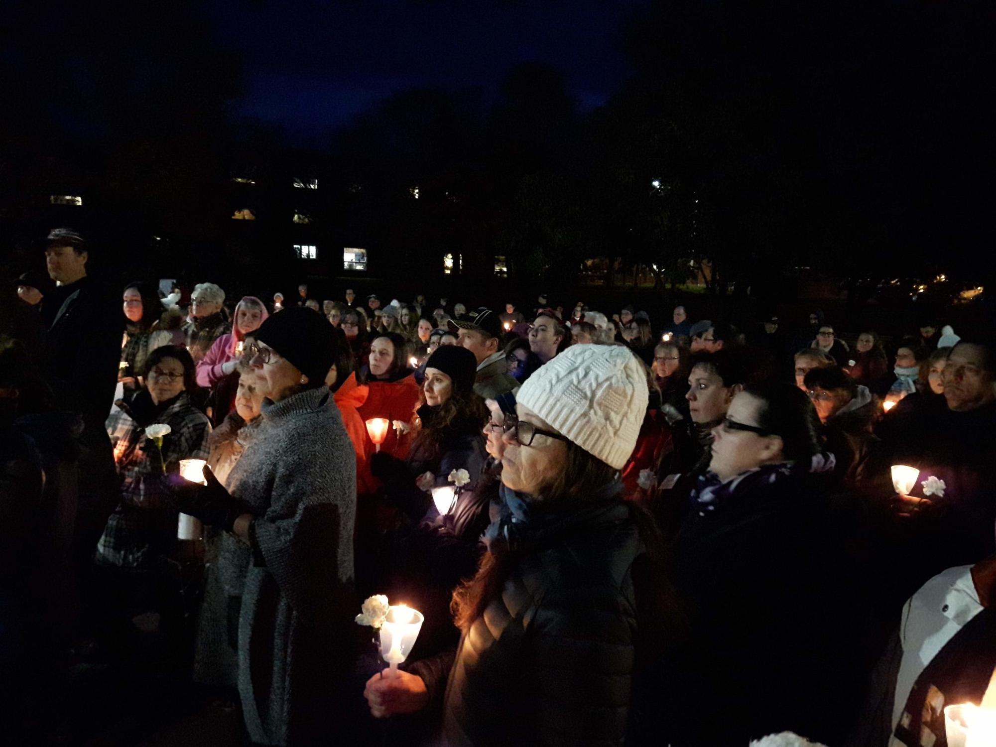 Emotion-filled vigil brings community together in grief and support