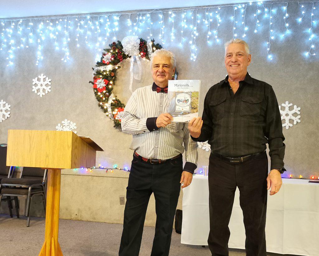 François Marion (at left) is seen here with Marcel Clément, the author of 'Marionville' which tells the story of Marionville, the community and its people. Photo: Louise Sproule