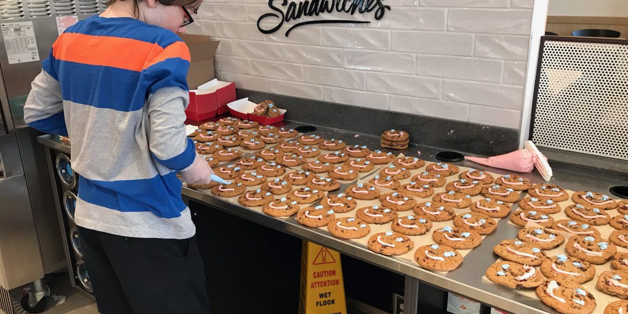 Volunteer decorates 300 smile cookies