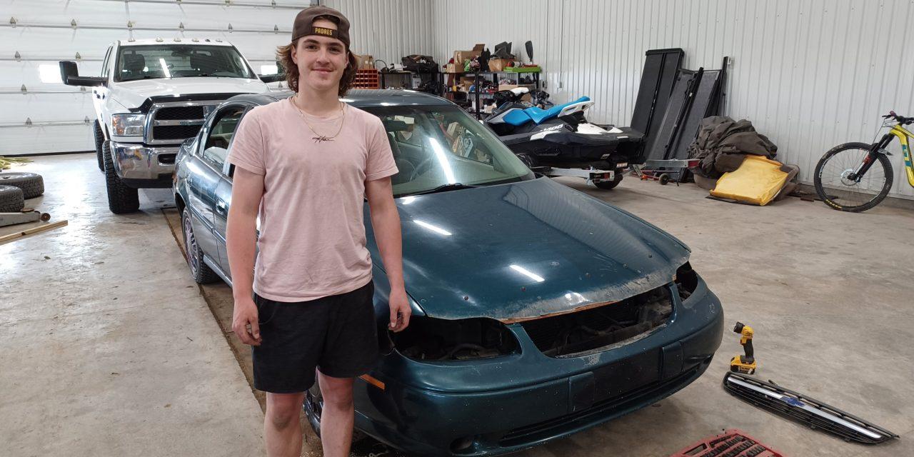 Kirby and Marchenko preparing cars for demolition derby