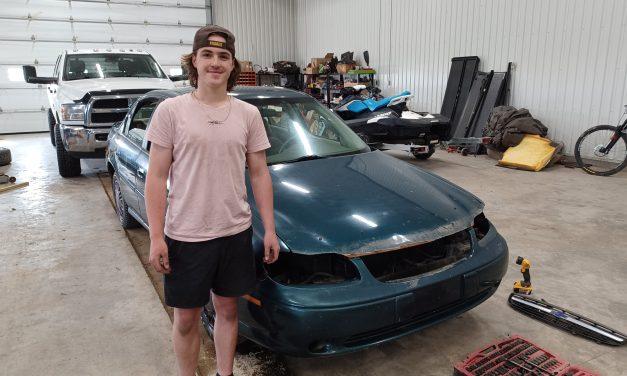 Kirby and Marchenko preparing cars for demolition derby
